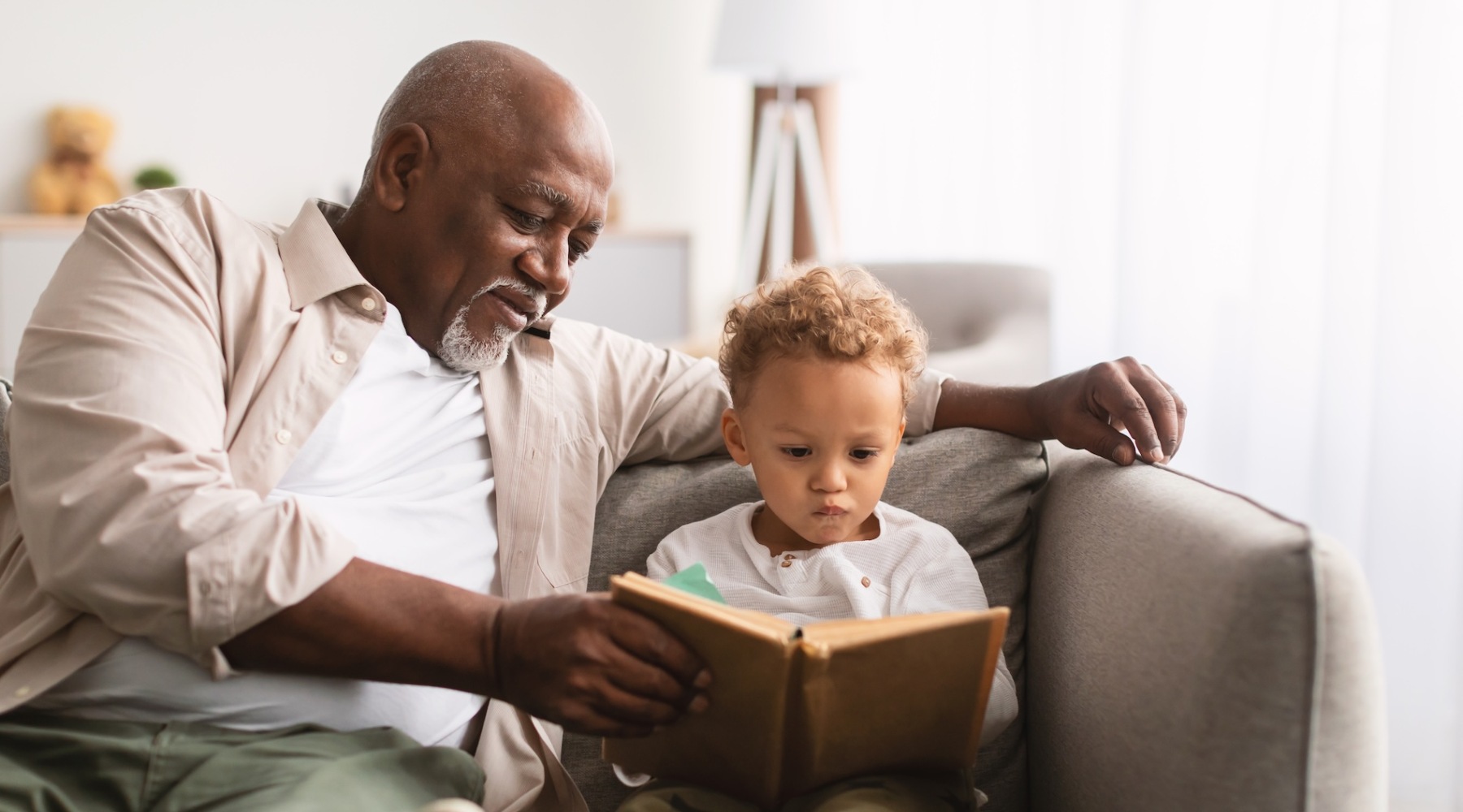 a man reading with a child