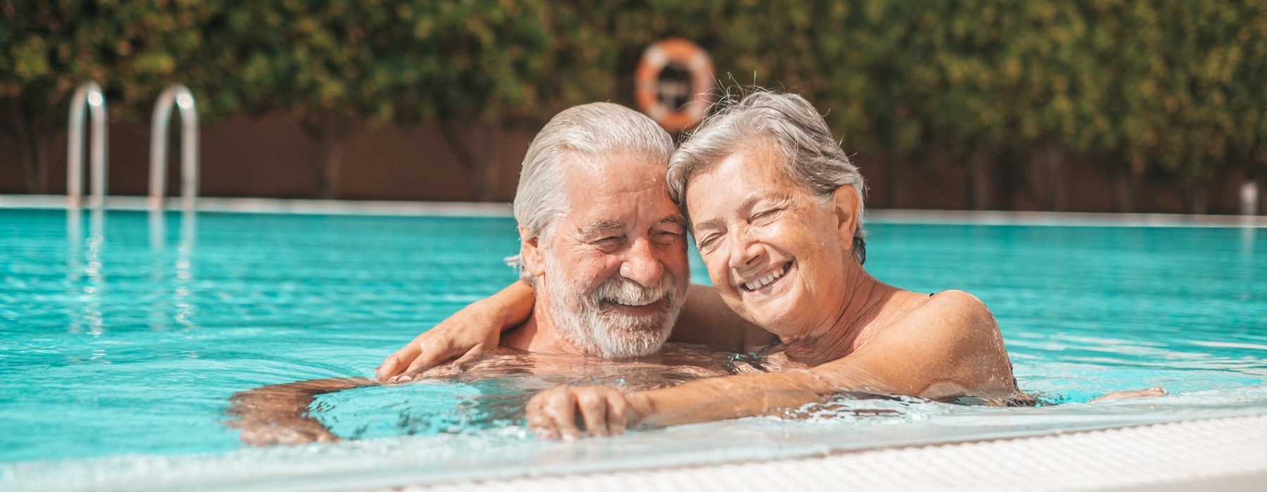 a man with a woman in a pool