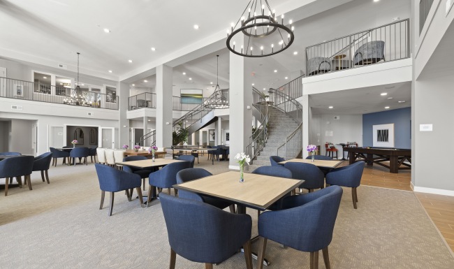 an area with tables and chairs for gathering 