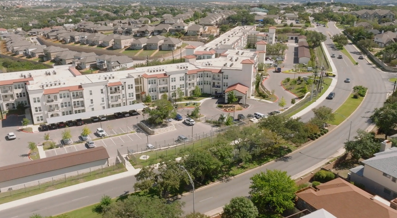Aerial view of Sage at Stone Oak senior living apartments in San Antonio, TX, featuring the apartment exterior.